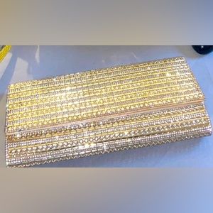 Classy gold and crystal clutch. Dress up or dress down!-Aldo